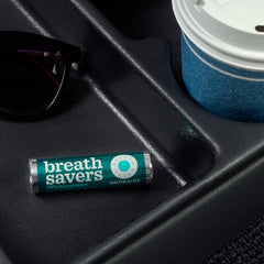 Breath Savers Wintergreen mints packaging open, showing twenty four rolls.