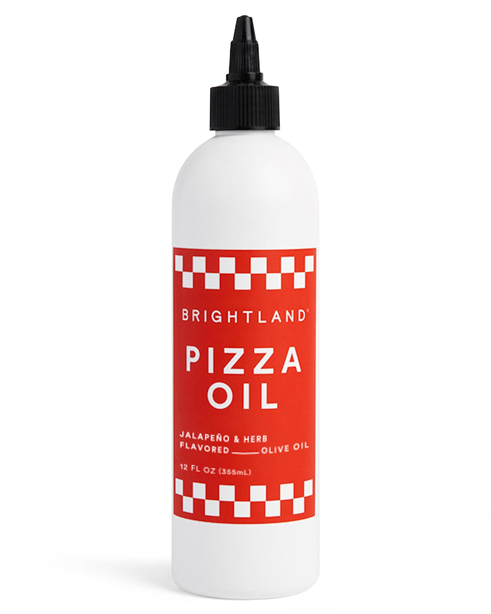 Brightland Pizza Oil bottle pouring a savory finish over a slice of bread