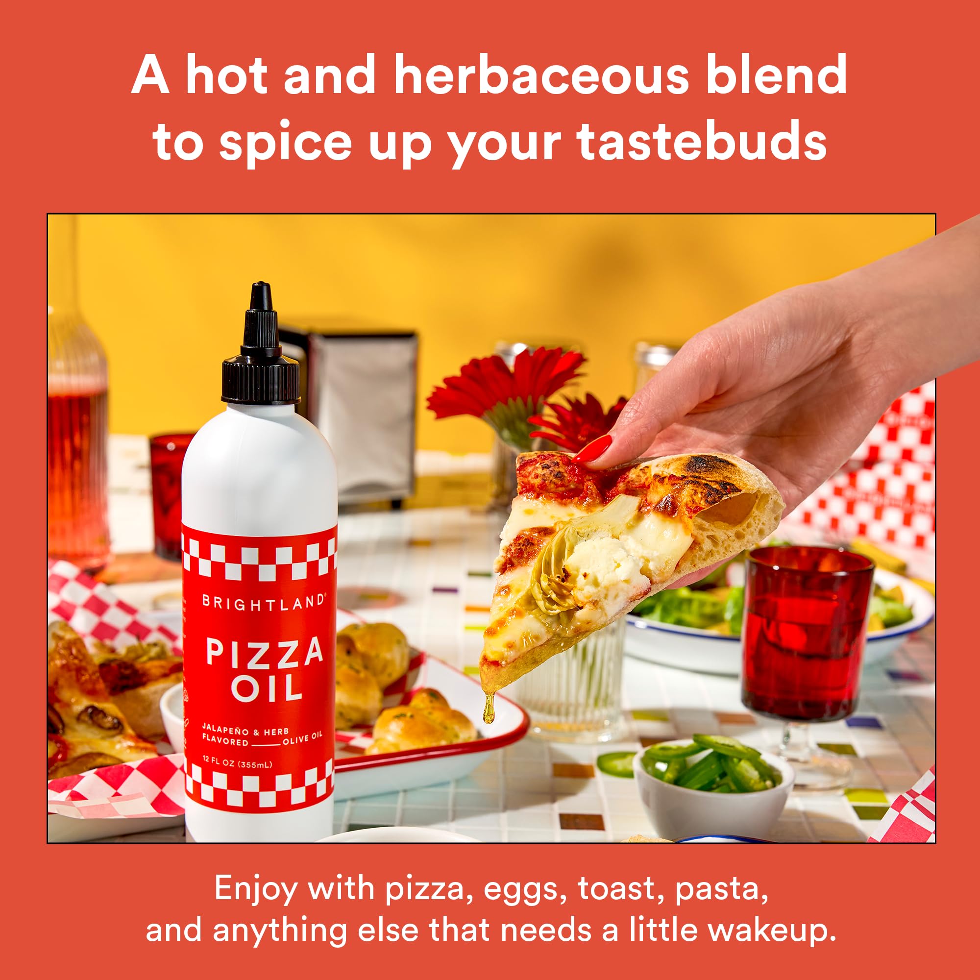 Brightland Pizza Oil close-up shows oregano and basil in a vibrant infusion