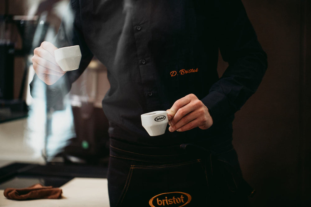 Bristot Classico cup steaming conveys aroma awakening morning rituals.