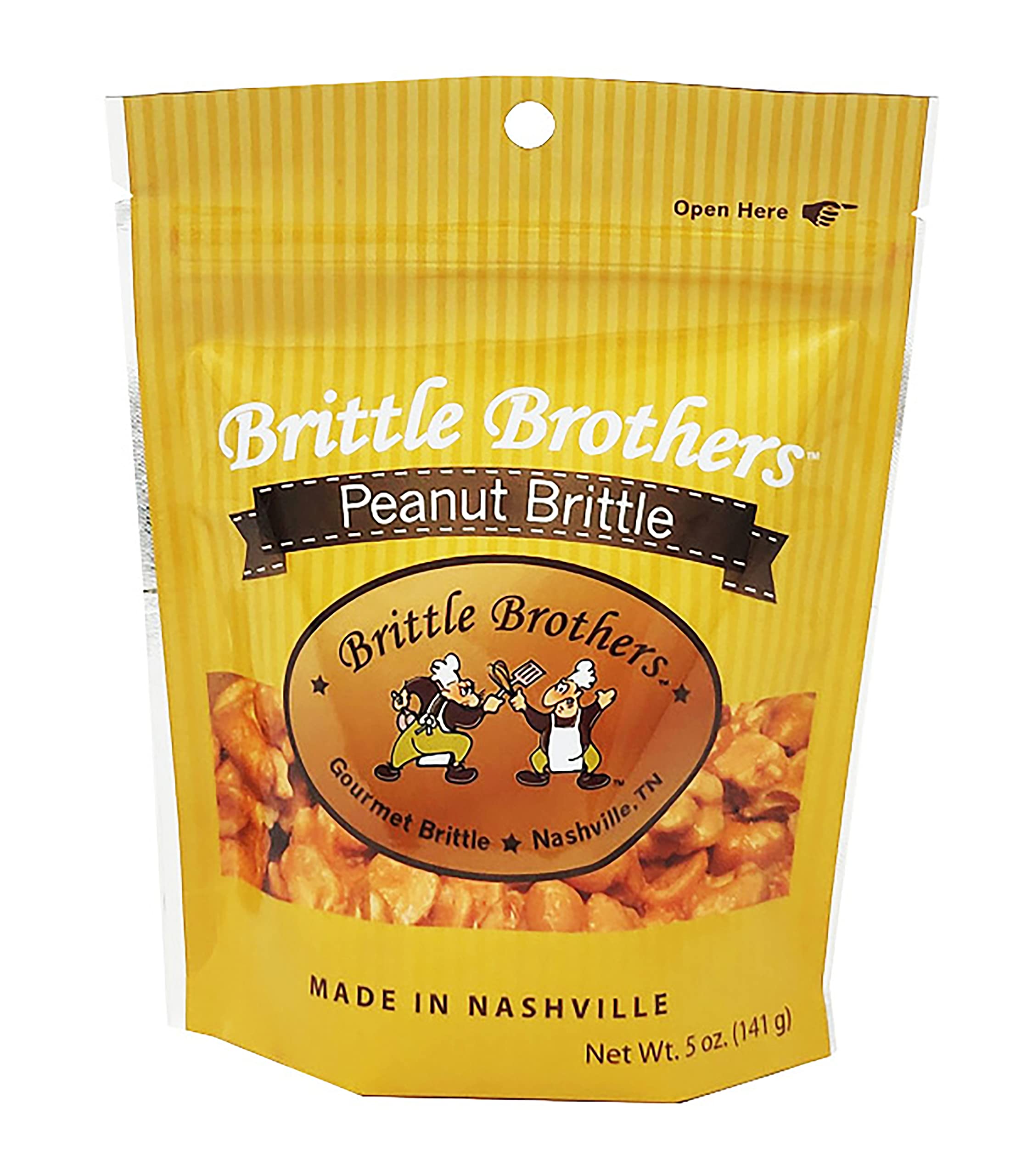 Brittle Brothers peanut brittle 5oz bottle on wood, showcasing crisp, nut-forward snacking.