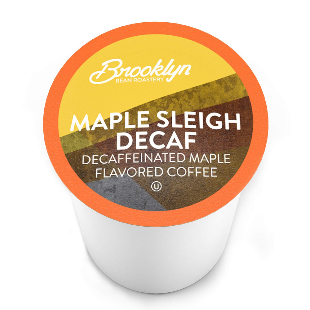 Brooklyn Beans Maple Sleigh decaf cup steaming with rich maple aroma.