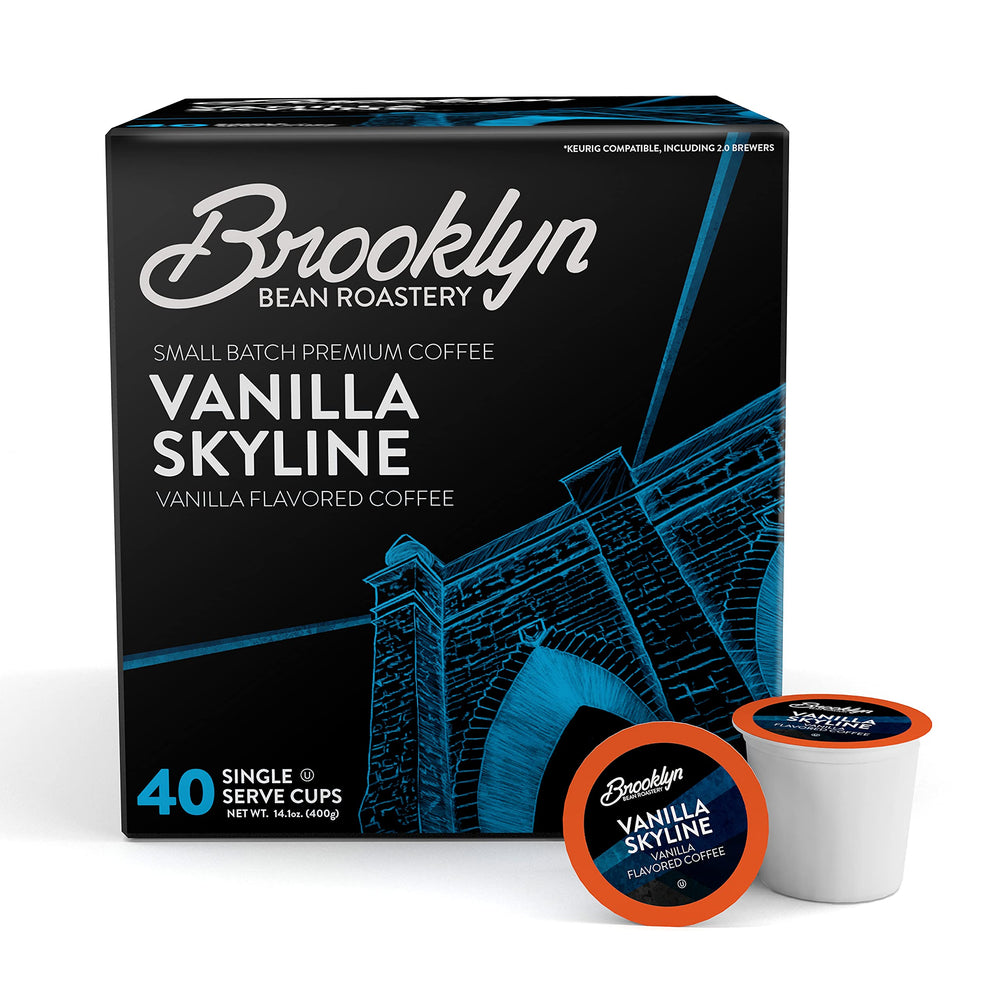 Brooklyn Beans Vanilla Skyline pod on counter beside a Keurig, creamy vanilla aroma.