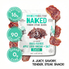 Brooklyn Biltong grass-fed beef jerky on a board with rich aroma.
