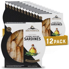 Brunswick wild caught brisling sardines in EVOO on a plate with glossy oil