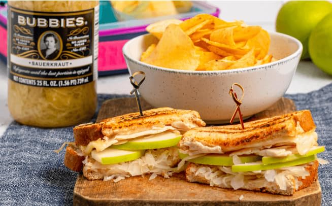 Bubbies serving board with pickles and cheese for snacking