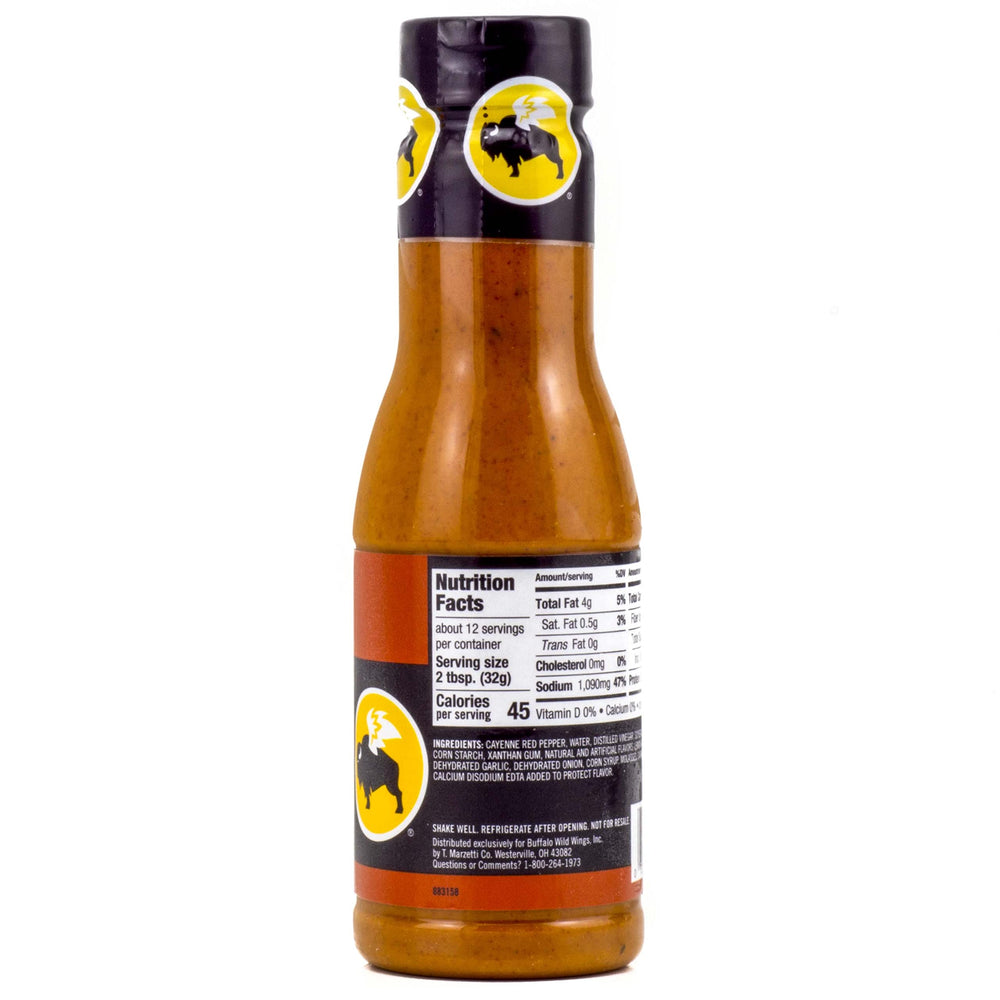 Buffalo Wild Wings hot sauce pour shows intense heat ideal for glazing.