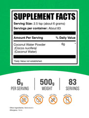 BulkSupplements Coconut Water Powder glass with mixer illustrating versatile use
