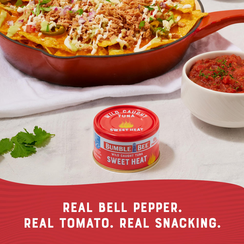 Bumble Bee Snackers Sweet Heat tuna on salad bowl shows protein-rich taste pairing.