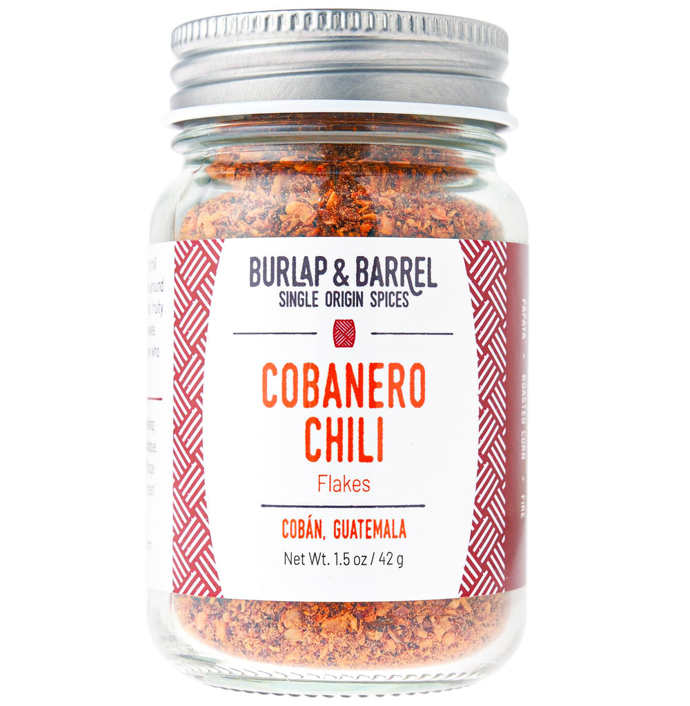 Burlap & Barrel Cobanero chili flakes in glass jar show smoky heat and fruity aroma.