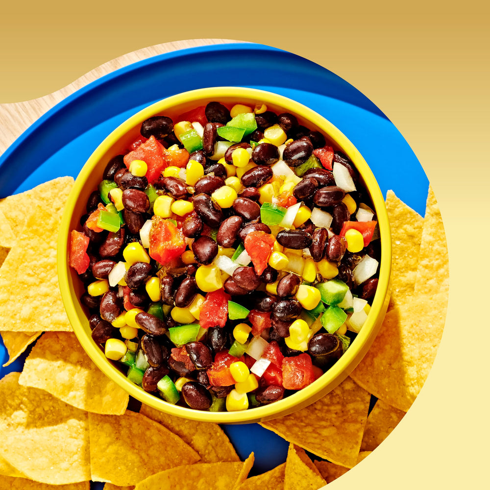 Bush's Best Organic Black Beans pantry can storage on a kitchen shelf.