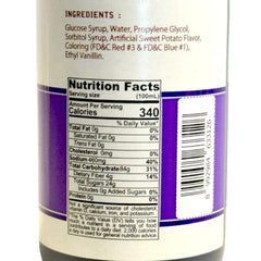 Butterfly Ube Flavoring Extract being poured for precise flavoring.
