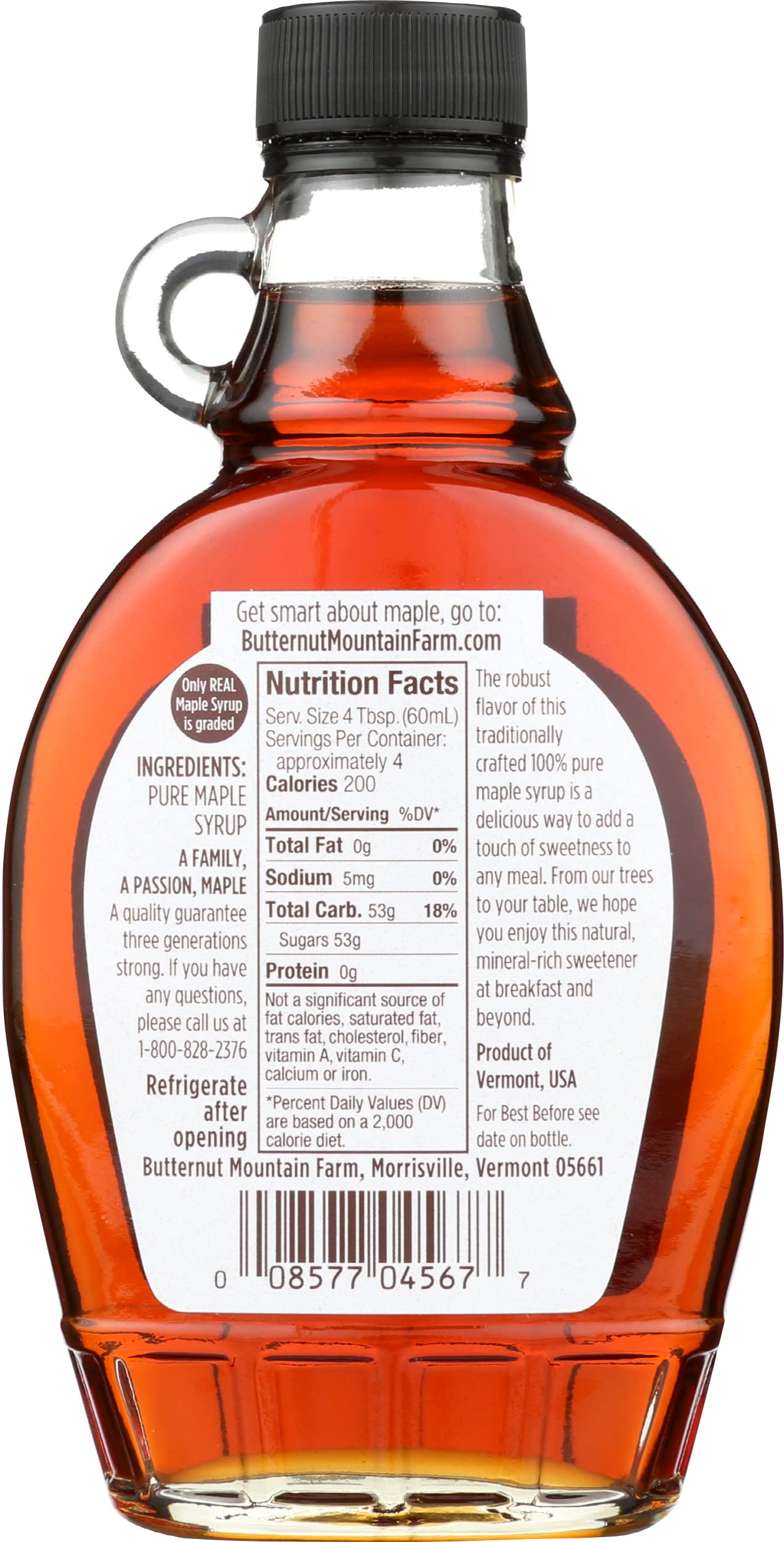 Butternut Mountain Farm Robust Dark Maple Syrup in a glass jar on a breakfast spread.