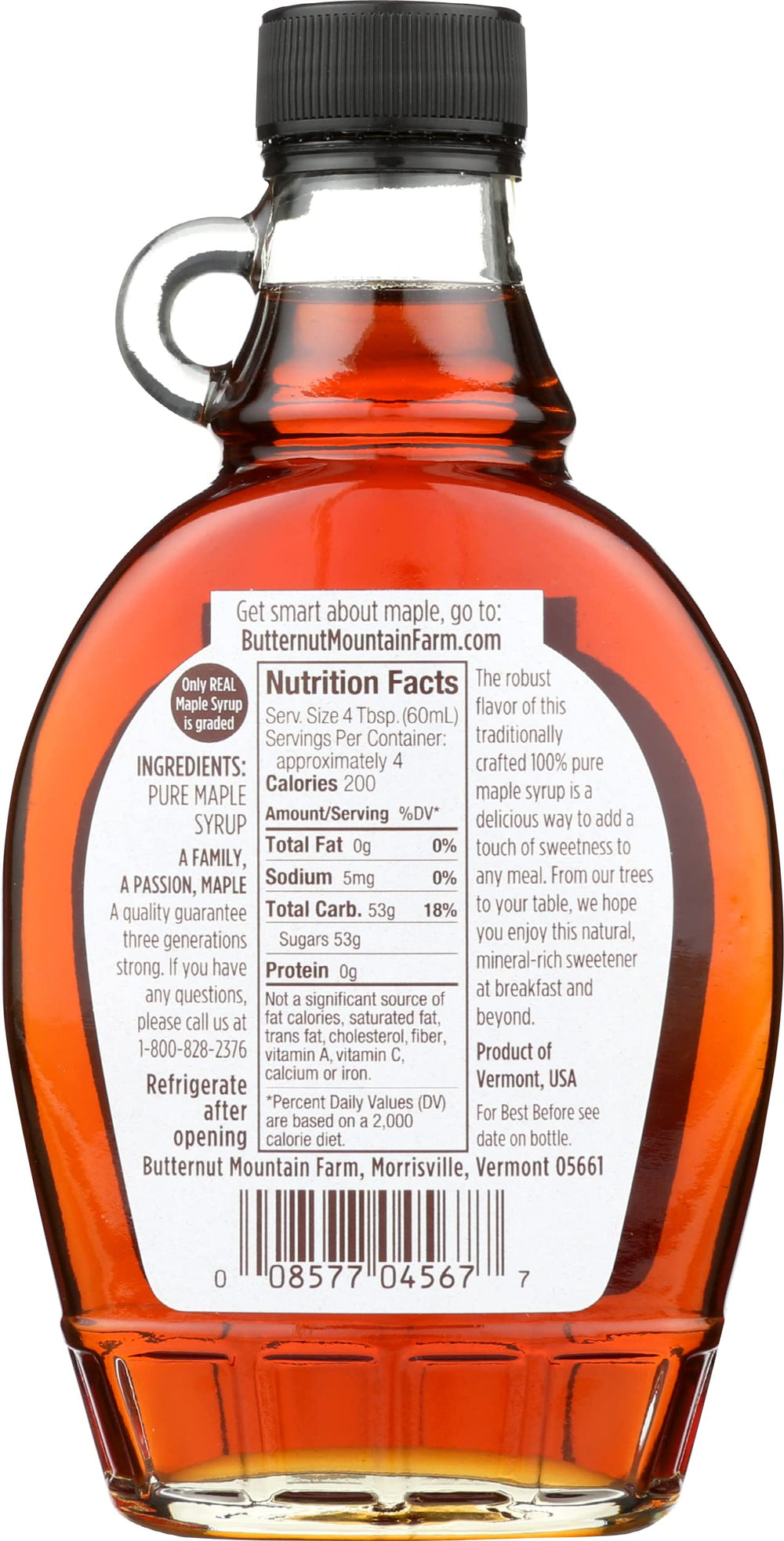 Butternut Mountain Farm Robust Dark Maple Syrup in a glass jar on a breakfast spread.