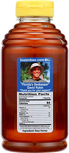 Buzzn Bee raw Florida honey pour in amber bottle ready for tea.
