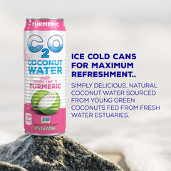 Pouring C2O coconut water into a glass for daily energy