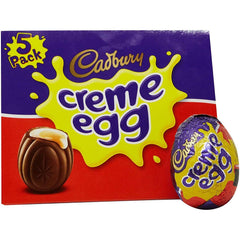 Cadbury Creme Eggs milk chocolate shell close-up, creamy exterior for chocolate lovers.