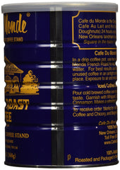 Cafe Du Monde dark roast chicory coffee can exudes bold aroma beside a steaming mug.