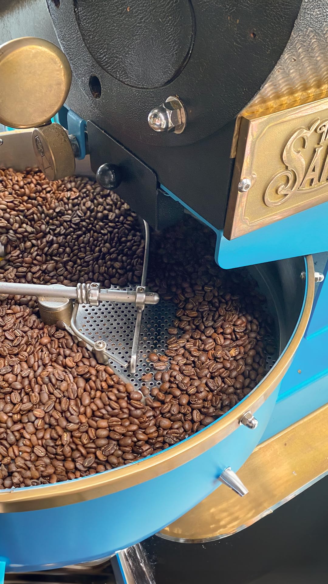Cafe Quindio medium roast hand-picked beans indicating artisanal care.