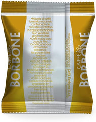 Caffè Borbone Respresso Gold capsules beside a prepared espresso shot