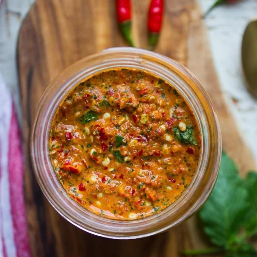 Cajun Chef Louisiana Hot Sauce bottle pour; add balanced heat during cooking.
