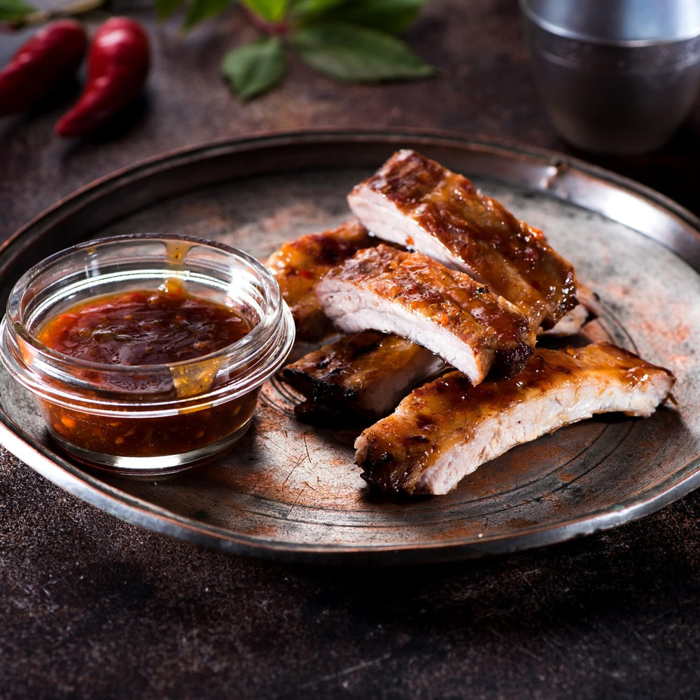 Cajun Power garlic sauce close-up shows glossy glaze and garlic-rich aroma.