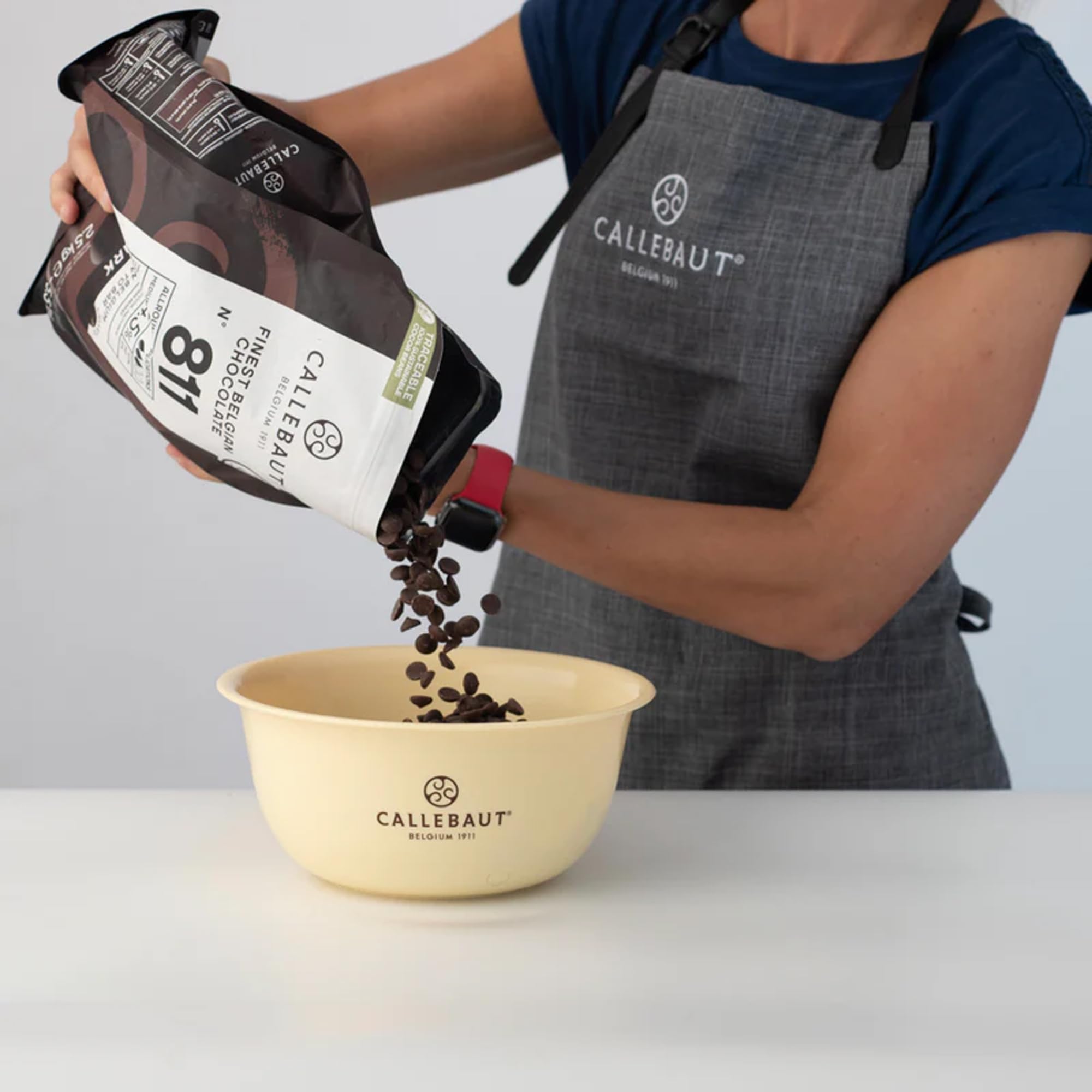 Callebaut No 811 callets in an enrobing setup for precise coatings.