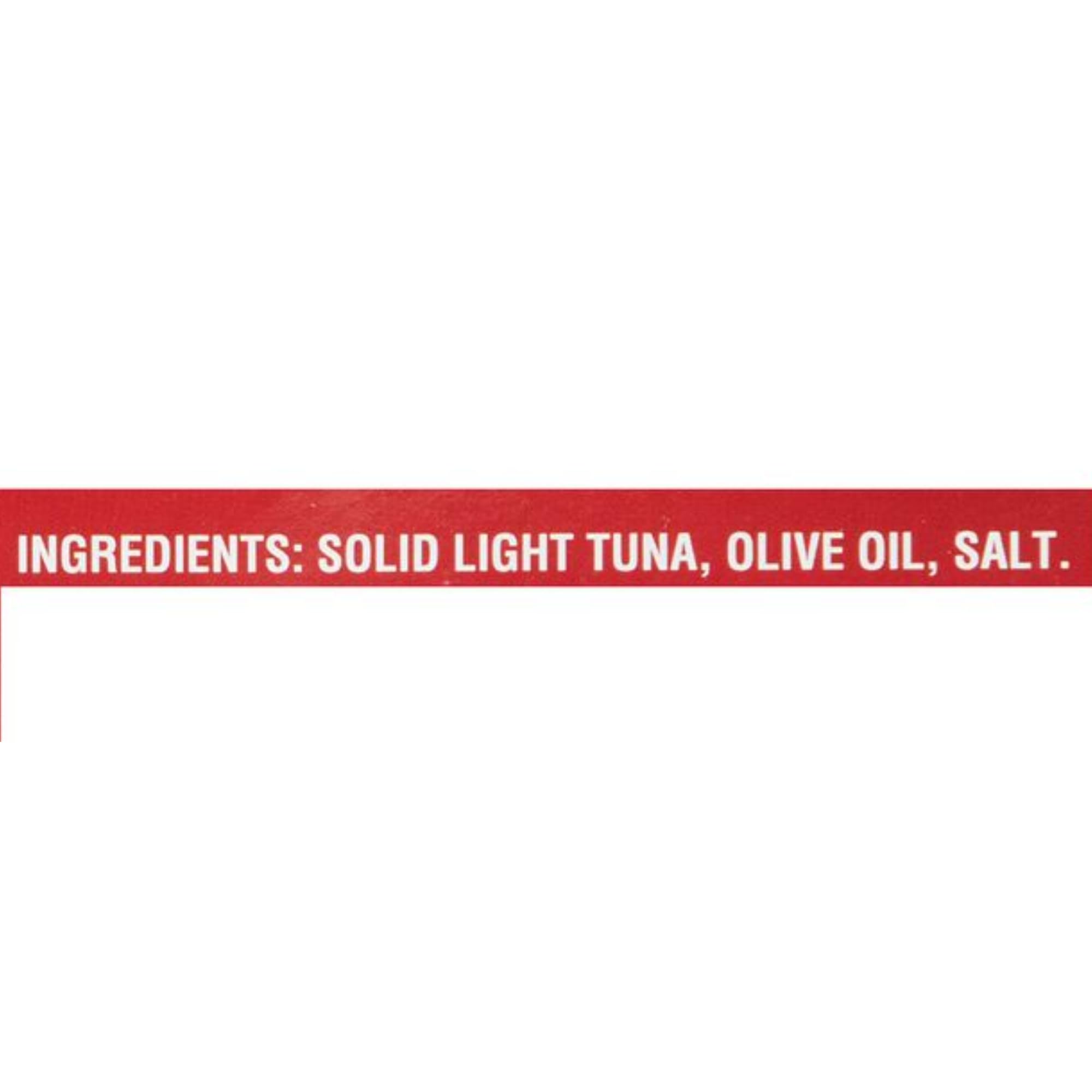 Callipo tuna in olive oil flakes on a spoon ideal for salads.
