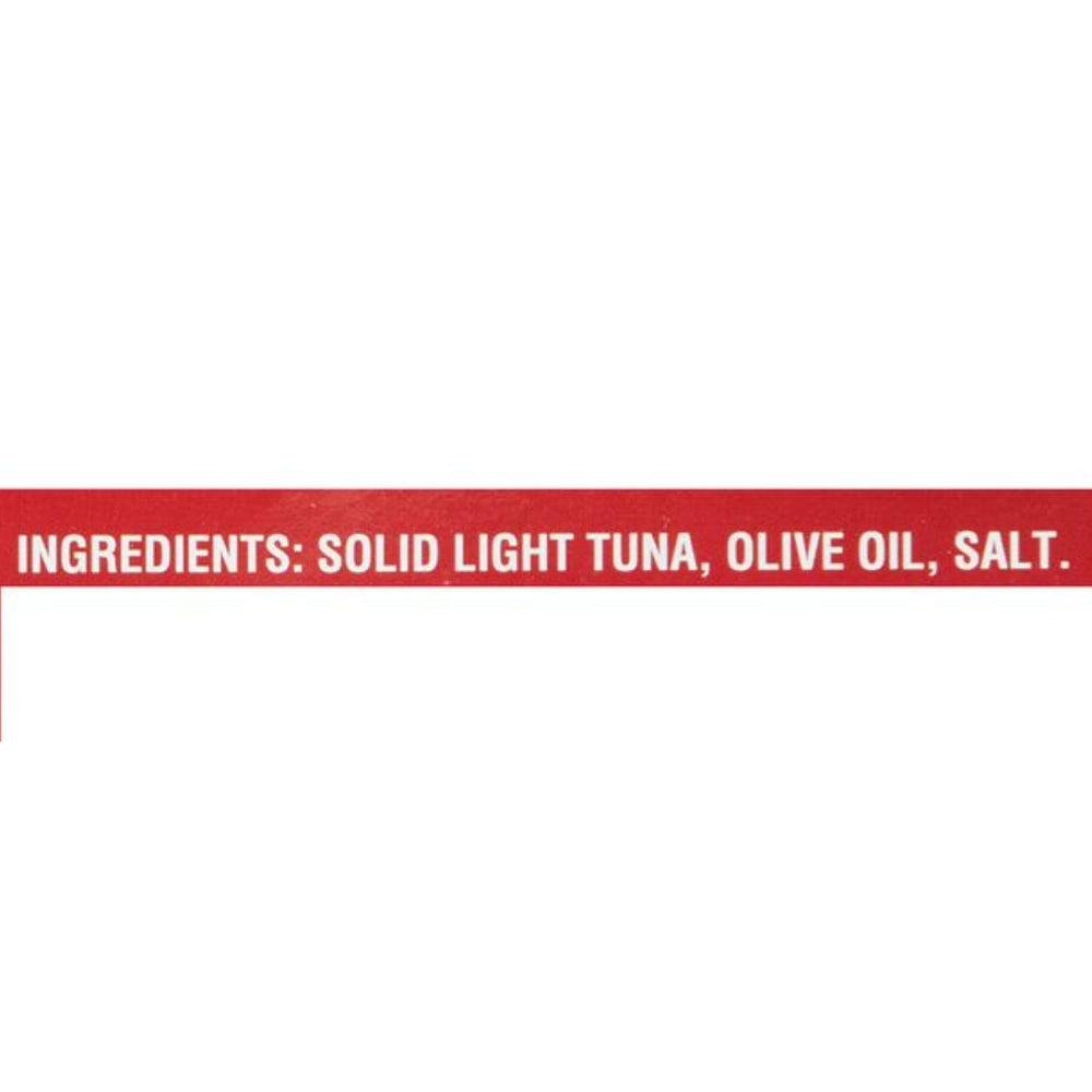 Callipo tuna in olive oil flakes on a spoon ideal for salads.