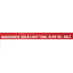 Callipo tuna in olive oil flakes on a spoon ideal for salads.