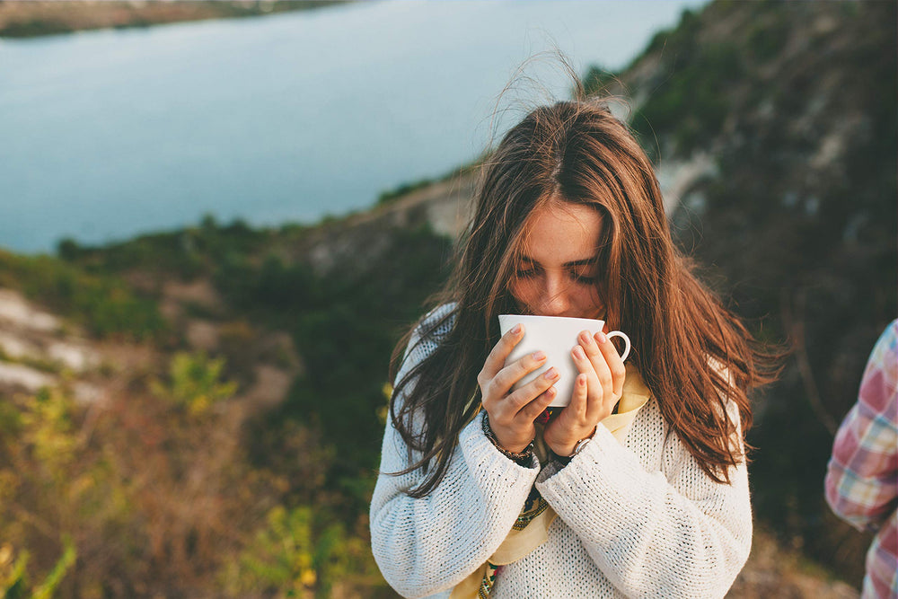 Calming Blends Diverticulitis Tea cup at dusk, highlighting caffeine-free option.
