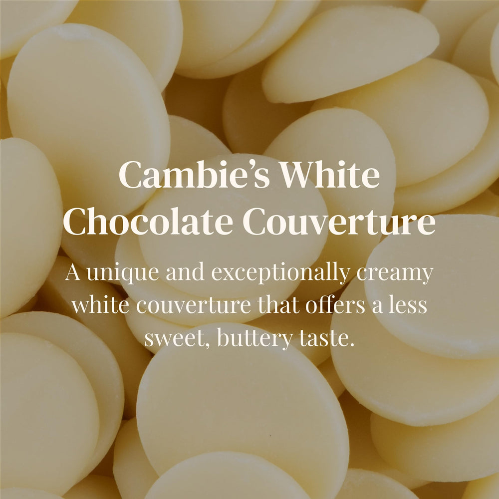 Cambie white chocolate wafers in bulk packaging for efficient production.