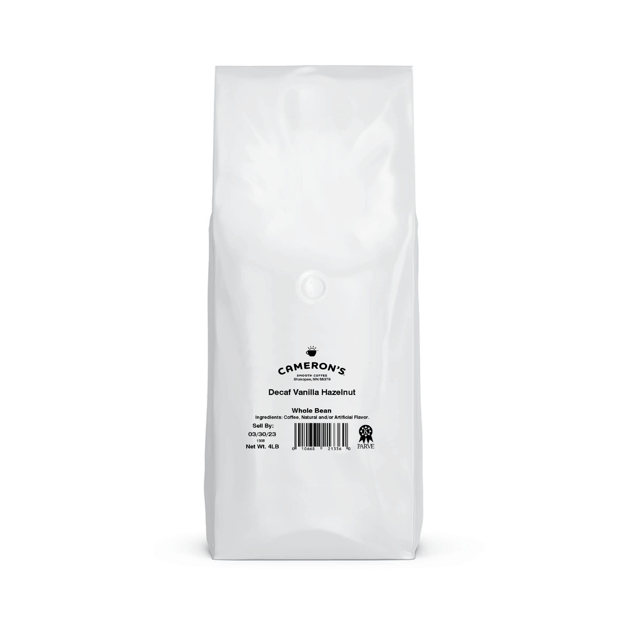 Steaming cup of Cameron's Decaf Vanilla Hazelnut with smooth aroma.