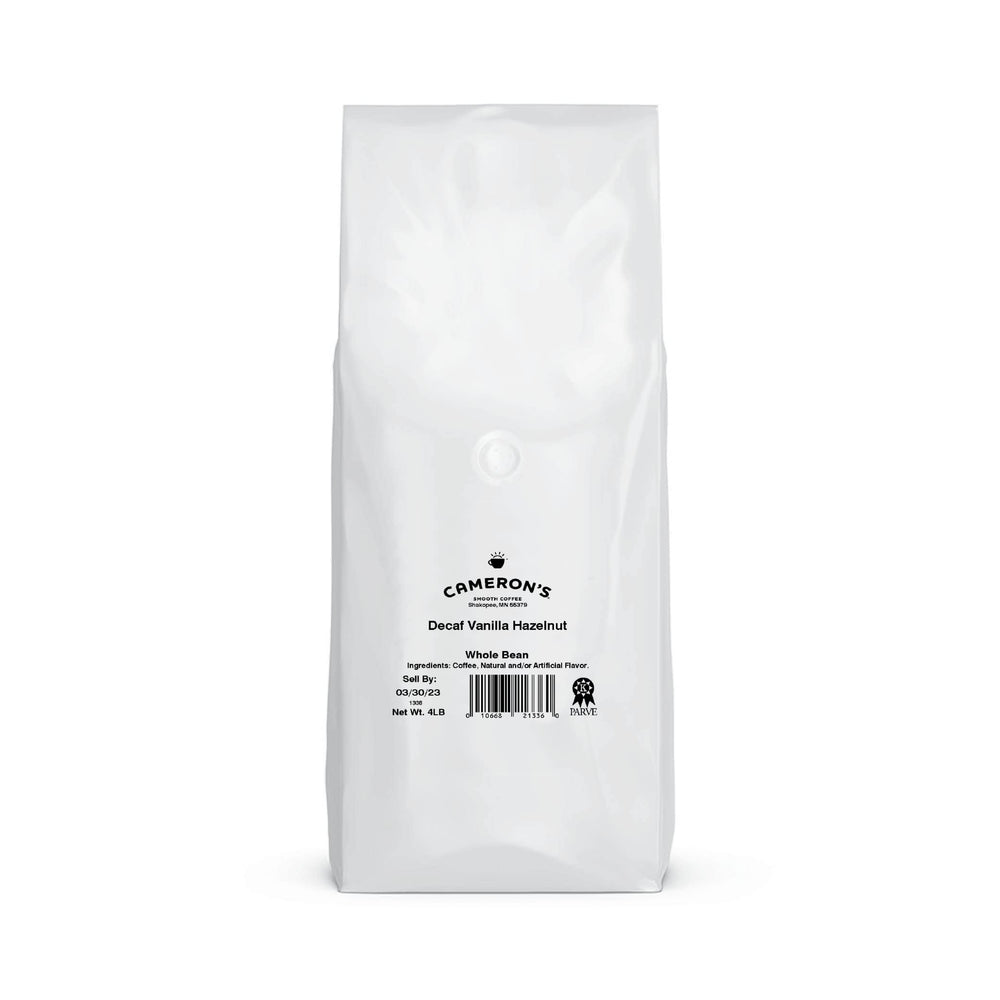 Steaming cup of Cameron's Decaf Vanilla Hazelnut with smooth aroma.
