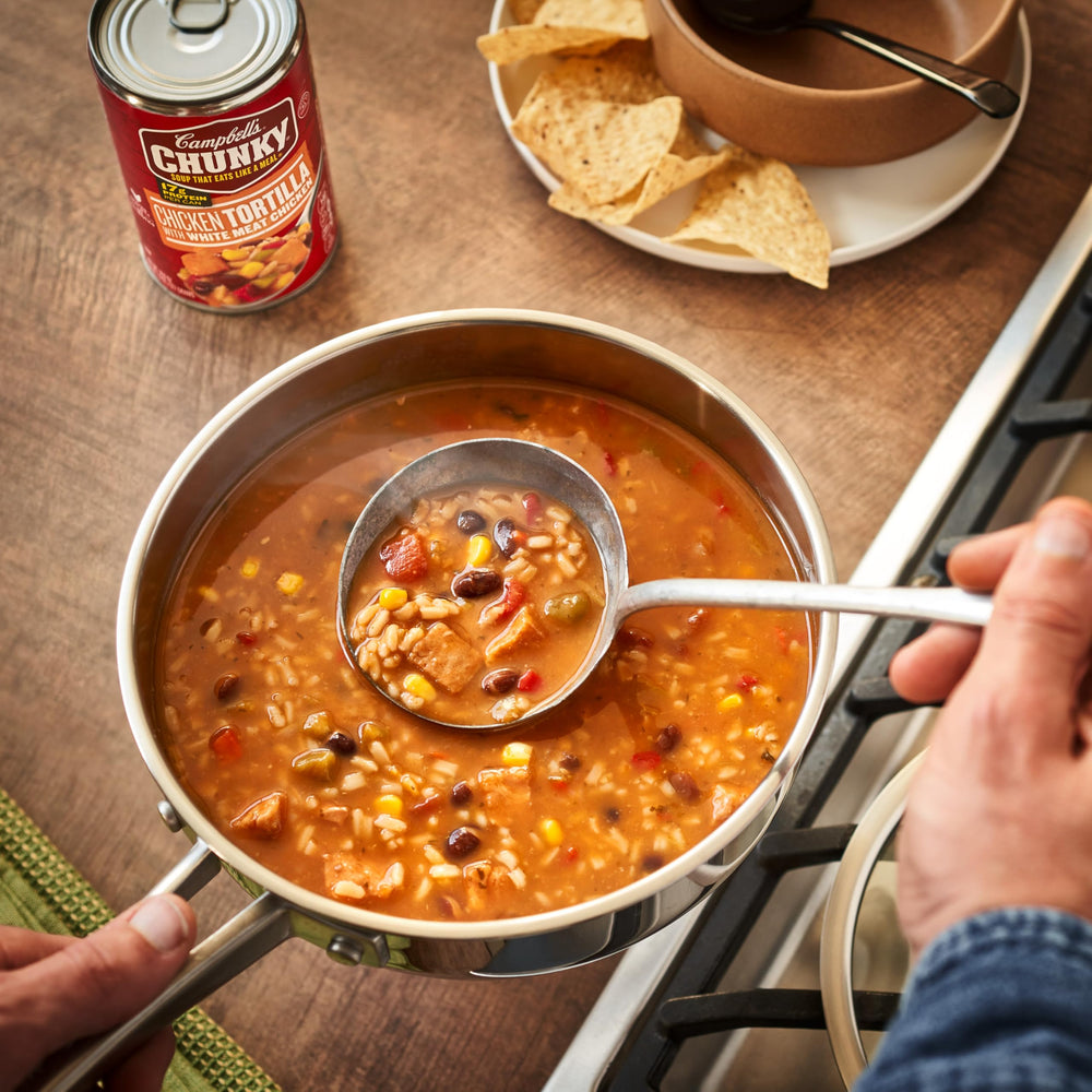 Campbell's Chunky Chicken Tortilla Soup warmed over a campfire for outdoor meals