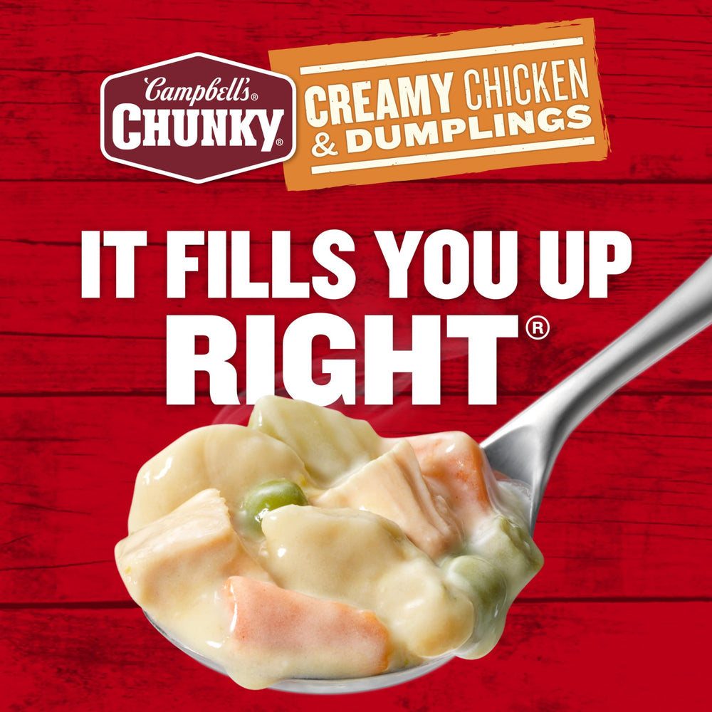 Campbell's Chunky soup heating over a campfire scenario.