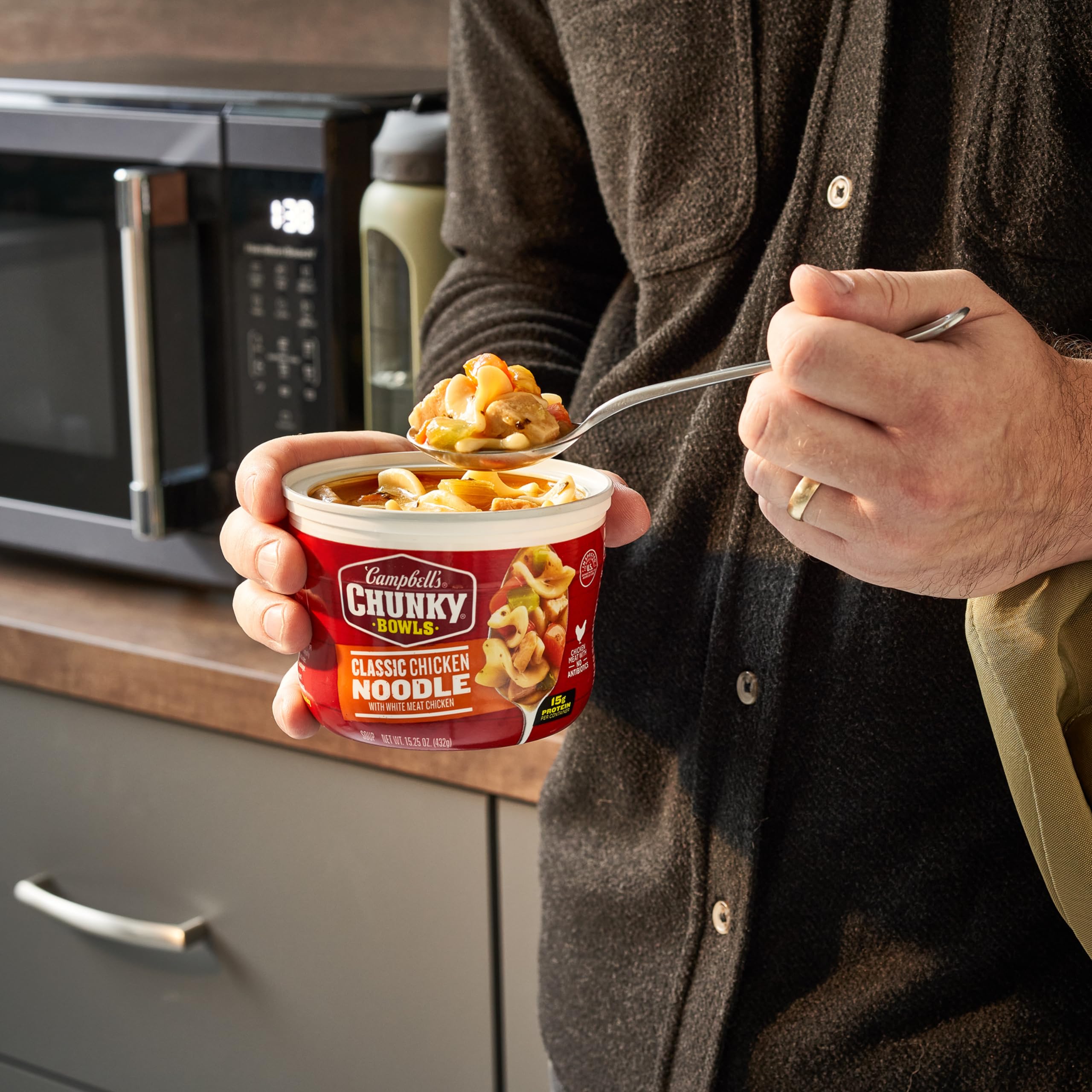 Campbell's Chunky Classic Chicken Noodle Soup ingredients close-up highlighting protein and veggies.