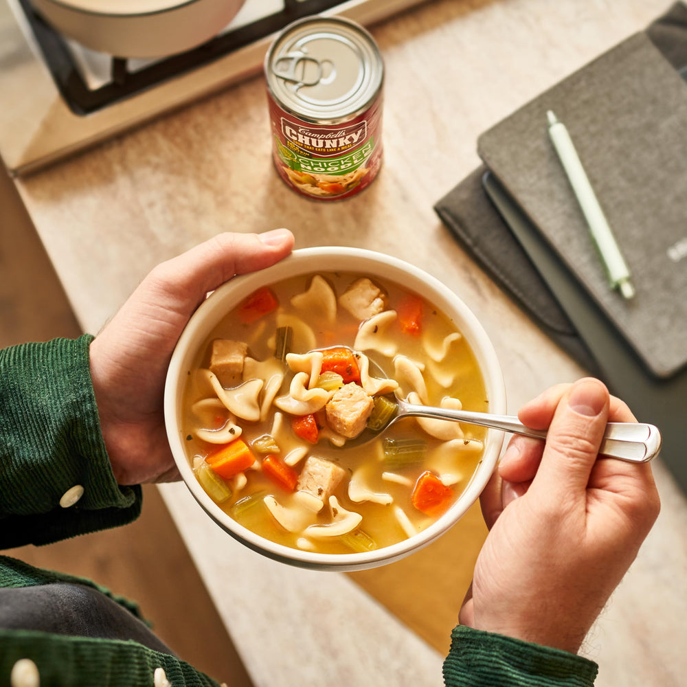 Campbell's Chunky Healthy Request Chicken Noodle Soup noodles detail and broth texture.