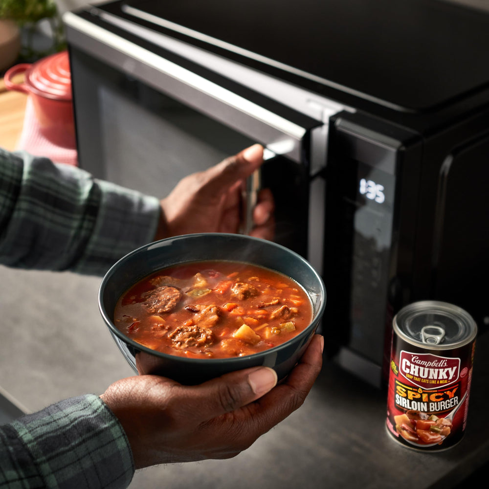 Campbell's Chunky Spicy Sirloin Burger Soup bowl with bacon and vegetables.