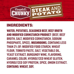 Serving bowl of Campbell's Chunky Steak and Potato Soup showing potatoes and beef pieces.