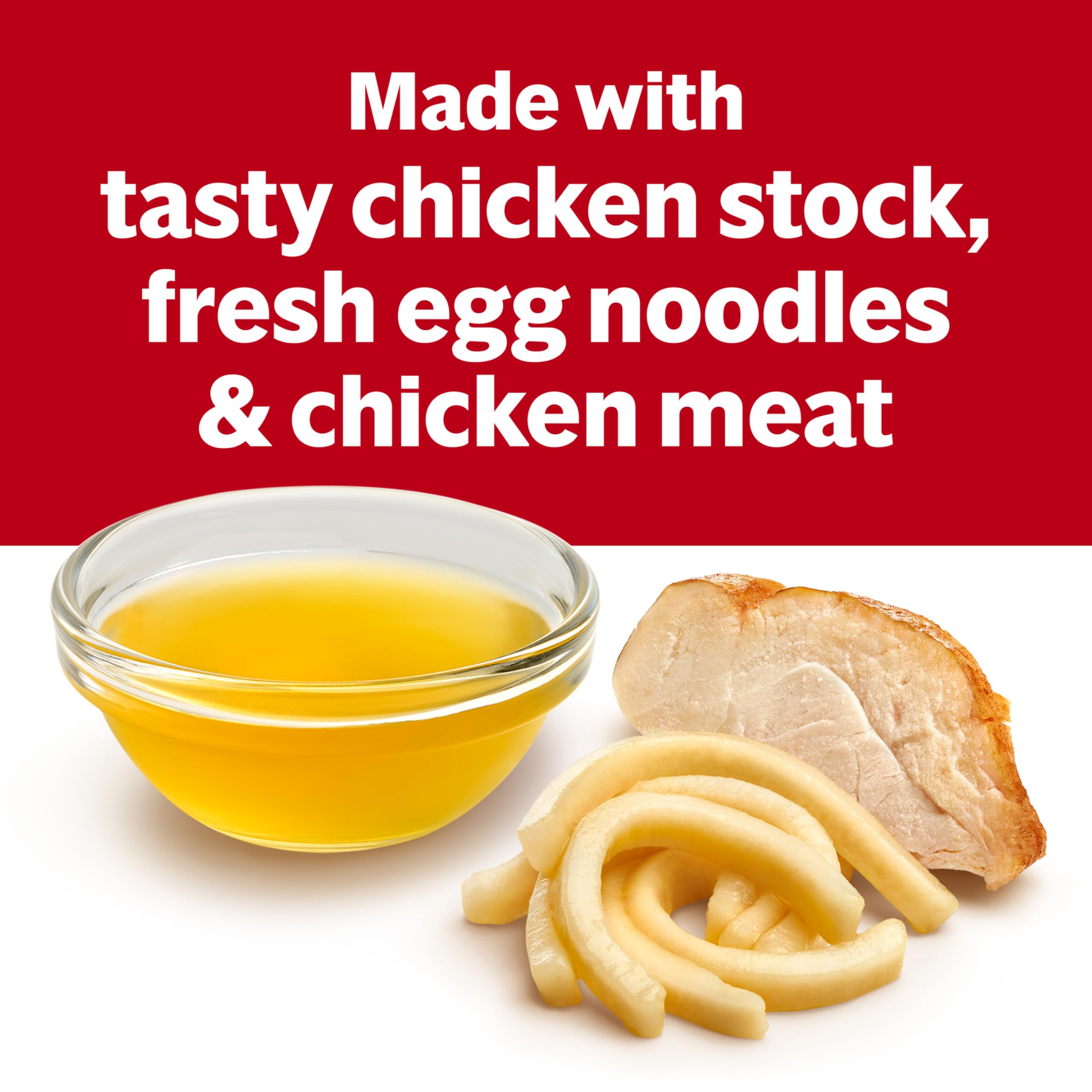 Close view of egg noodles and chicken in Campbell's soup.