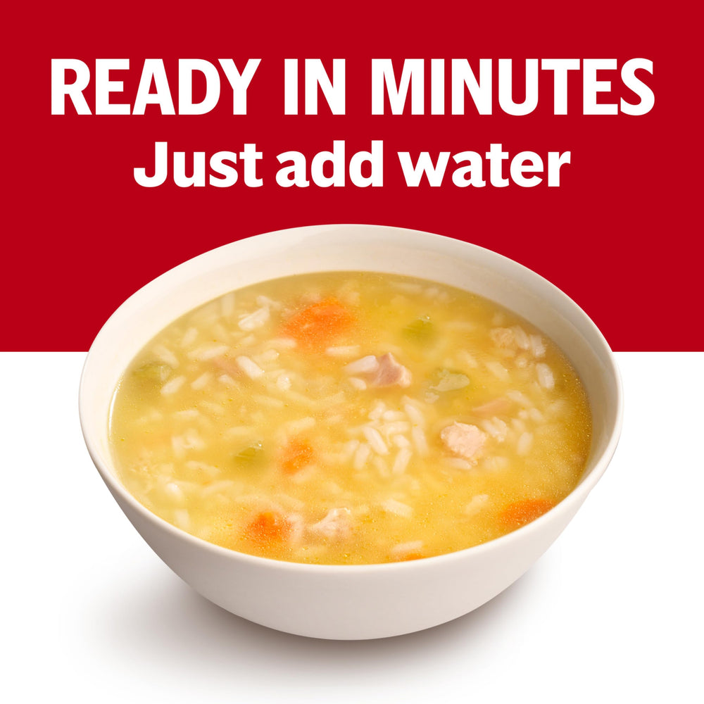 Campbell's label close-up; highlights broth, rice, and antibiotic-free chicken.