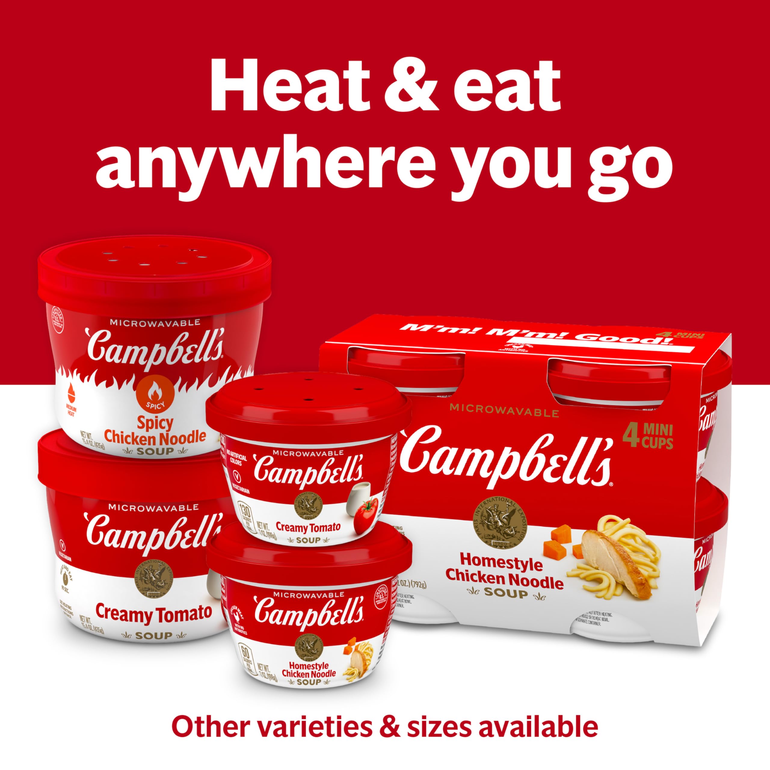 Cup with crackers beside Campbell's soup for a quick, complete lunch.