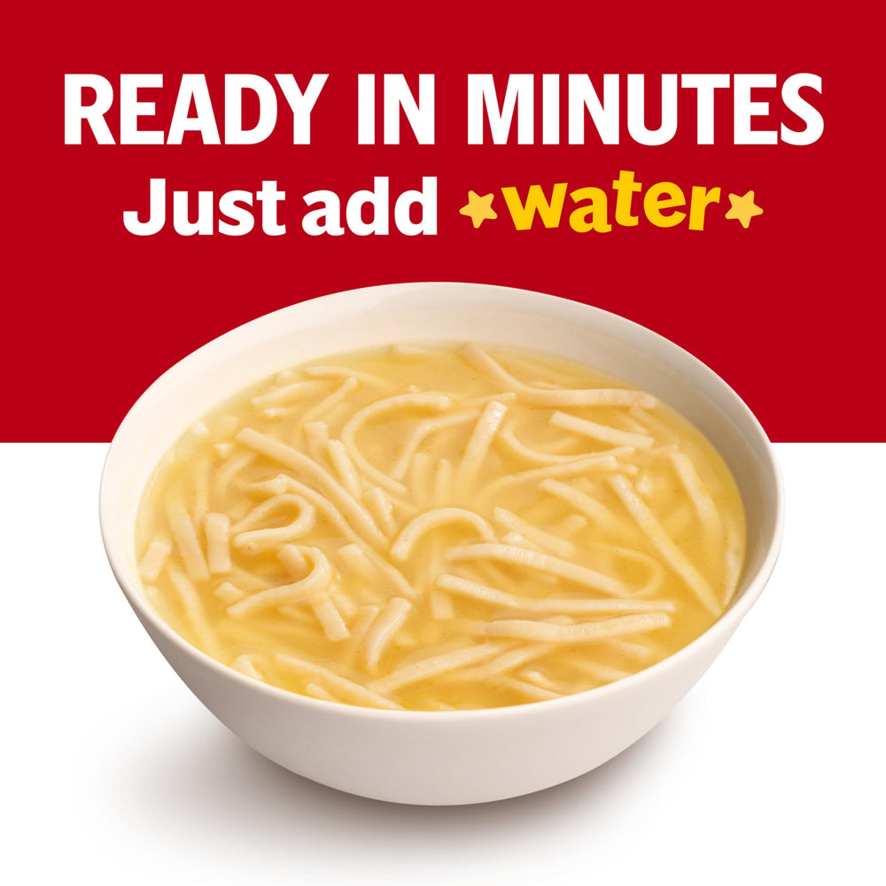 Microwaving Campbell’s Kids Double Noodle Soup in a covered bowl for convenience.