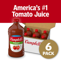 Glass with lime beside Campbell's Low Sodium Tomato Juice for breakfast