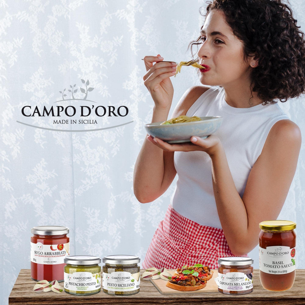 Campo D'Oro Pistachio Pesto Spread on crackers with herbs.
