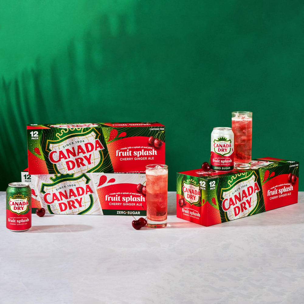 Canada Dry Fruit Splash Cherry Gingerale as a cocktail mixer beside a shaker.
