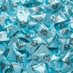 Candy Envy Baby shower favors display enhances table with blue accents.