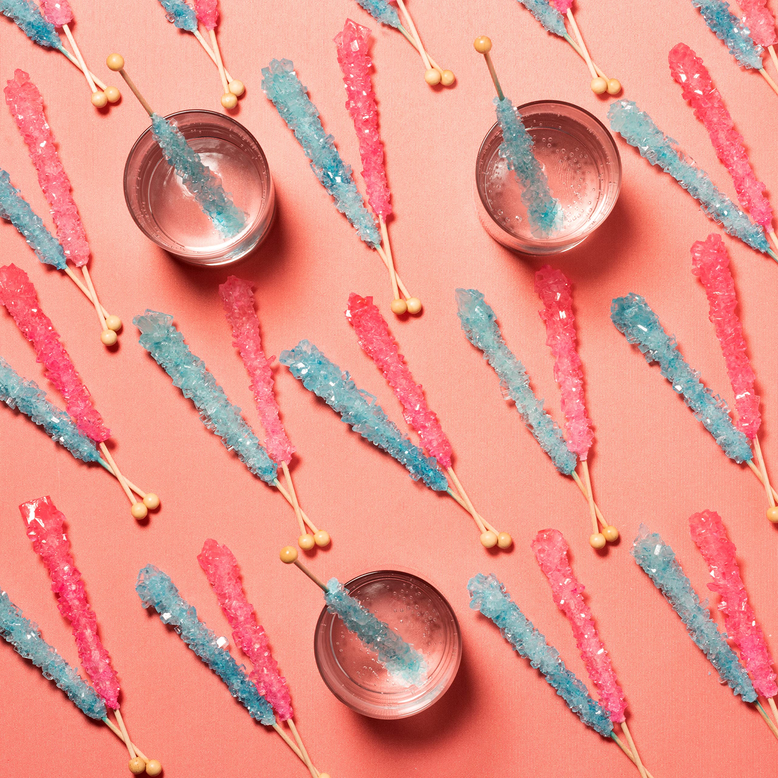 Candy Envy party table setup with rock candy sticks for colorful celebrations.