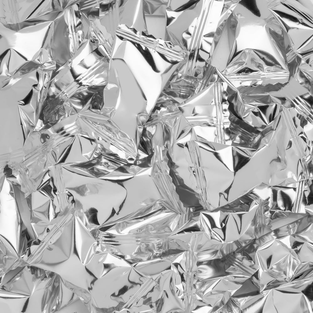 Candy Envy silver-foil wrap closeup shows premium mint texture.